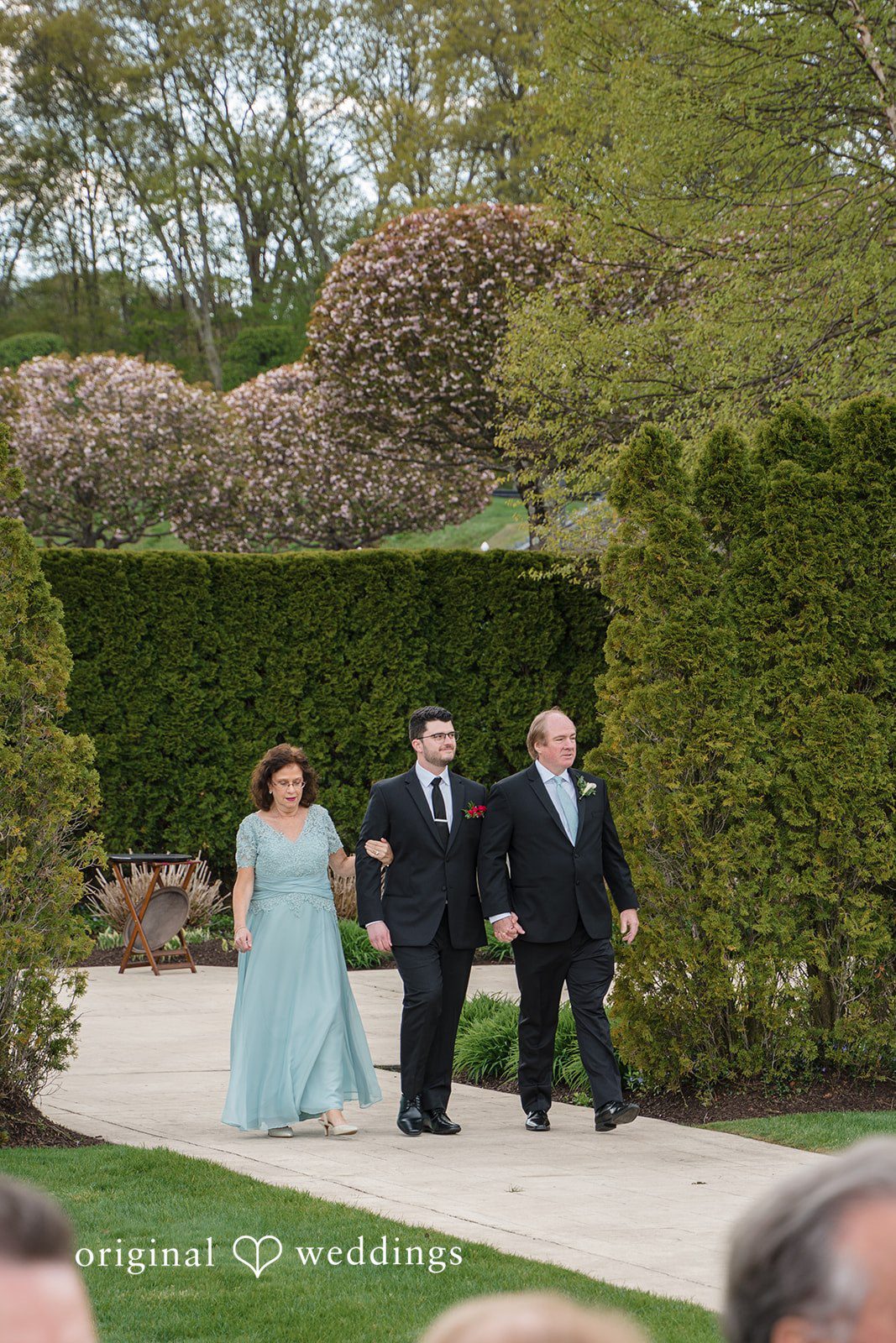 Outdoor wedding entrance during ceremony