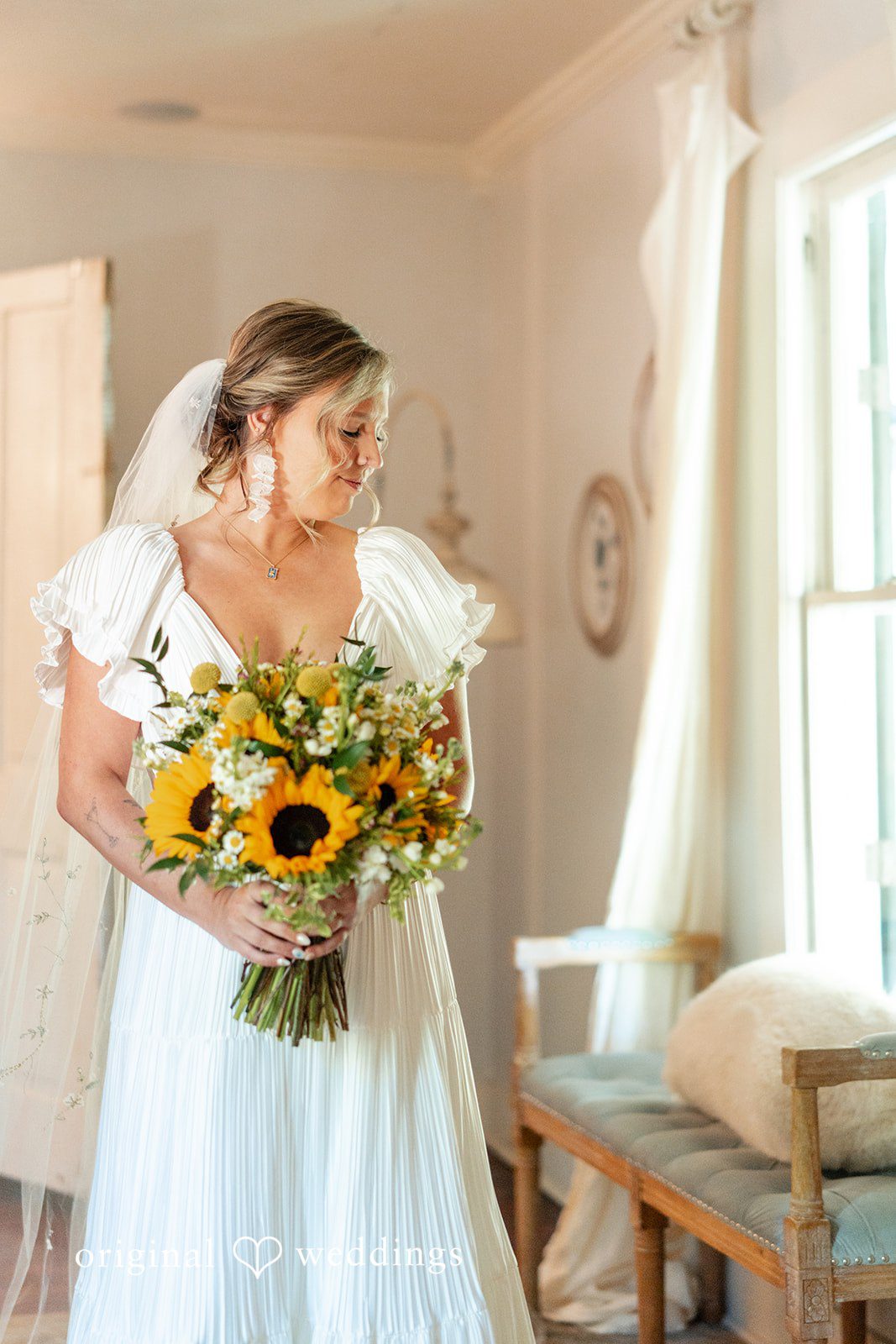 Elizabeth + Zodi Bride holding her bouquet after finishing preparations
