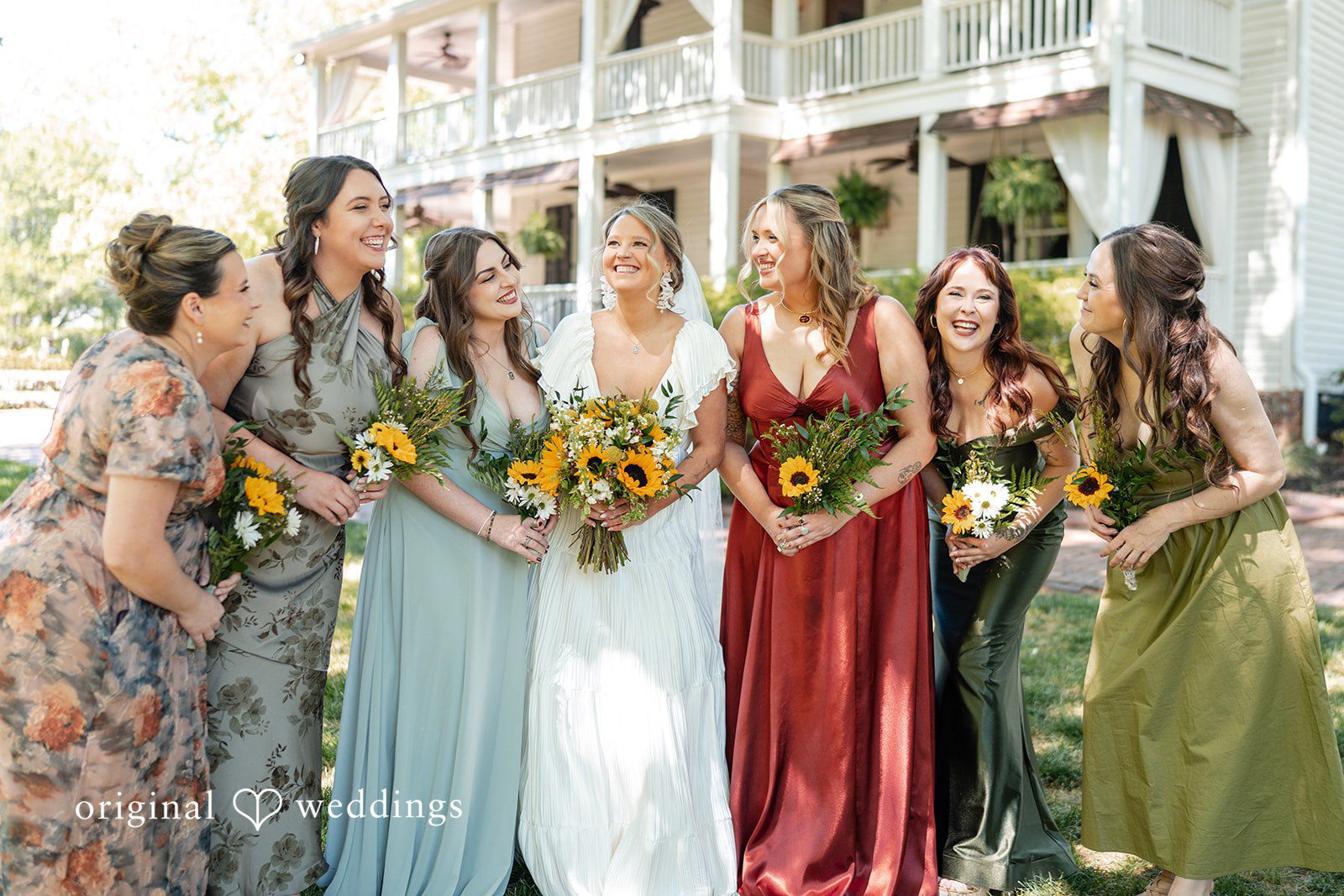 Elizabeth + Zodi Bride posing with her bridesmaids before the ceremony