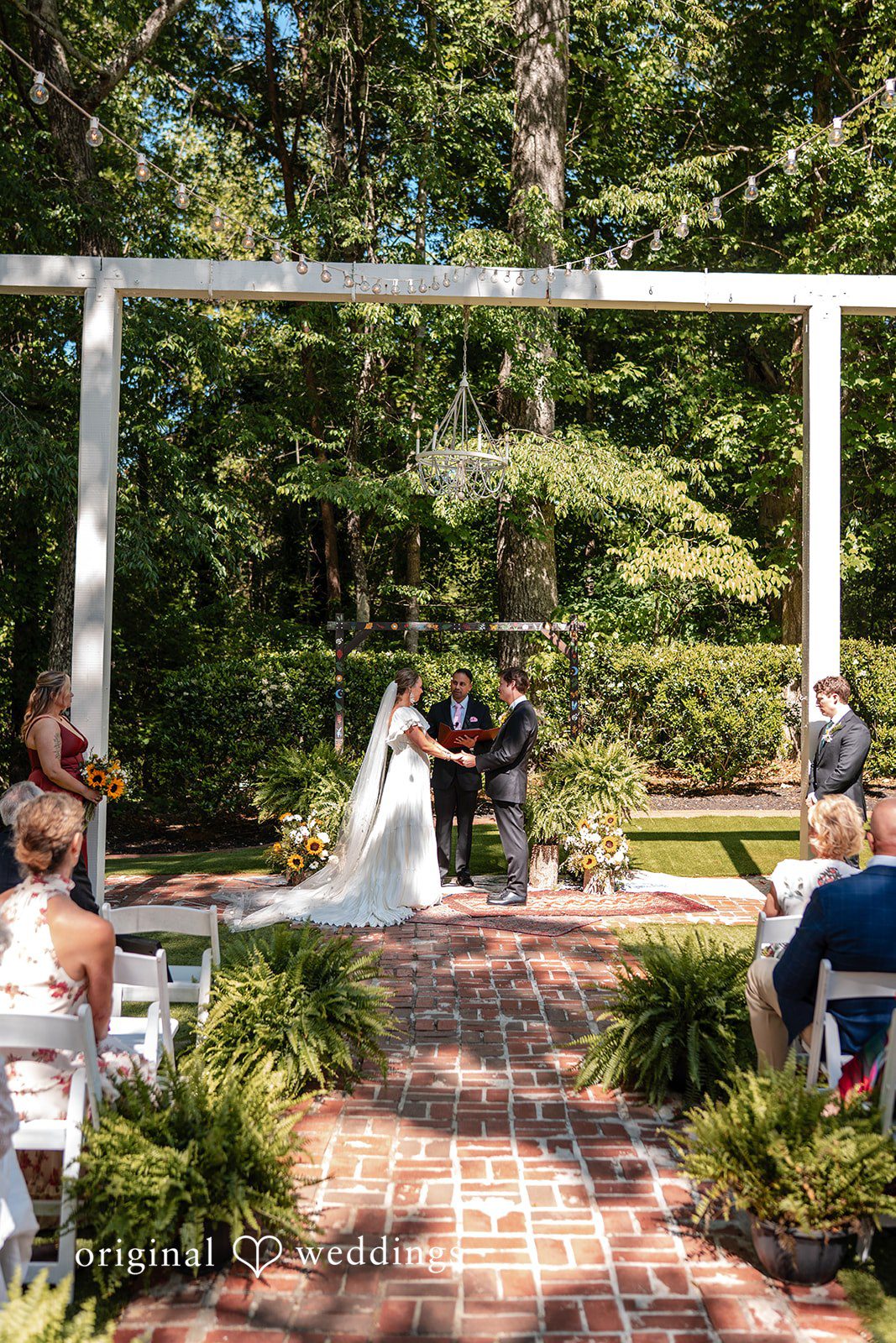 Elizabeth + Zodi Bride and groom exchanging vows at The Wheeler House ceremony