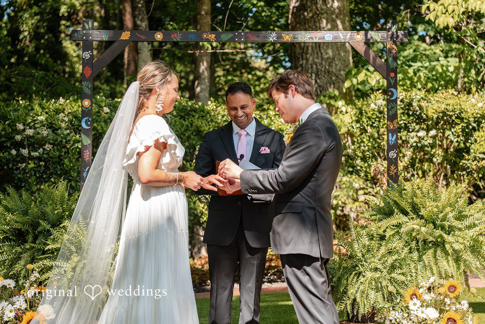 Elizabeth + Zodi Bride and groom sharing their first kiss after the ceremony