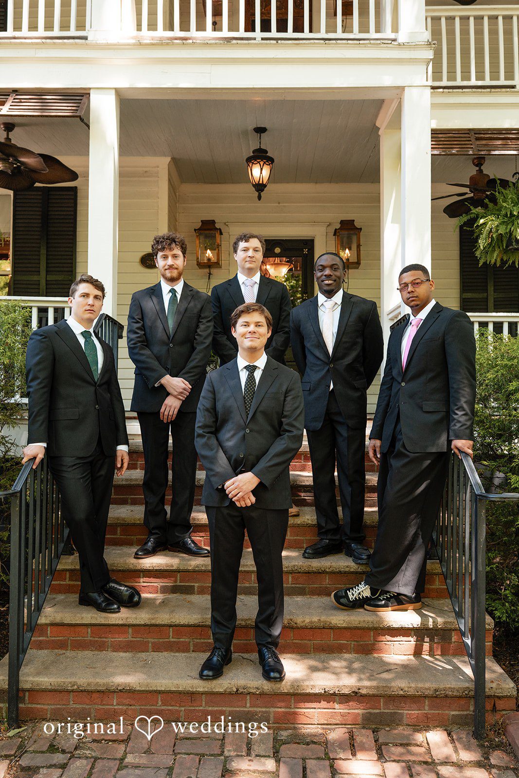 Elizabeth + Zodi Groom posing with his groomsmen at The Wheeler House