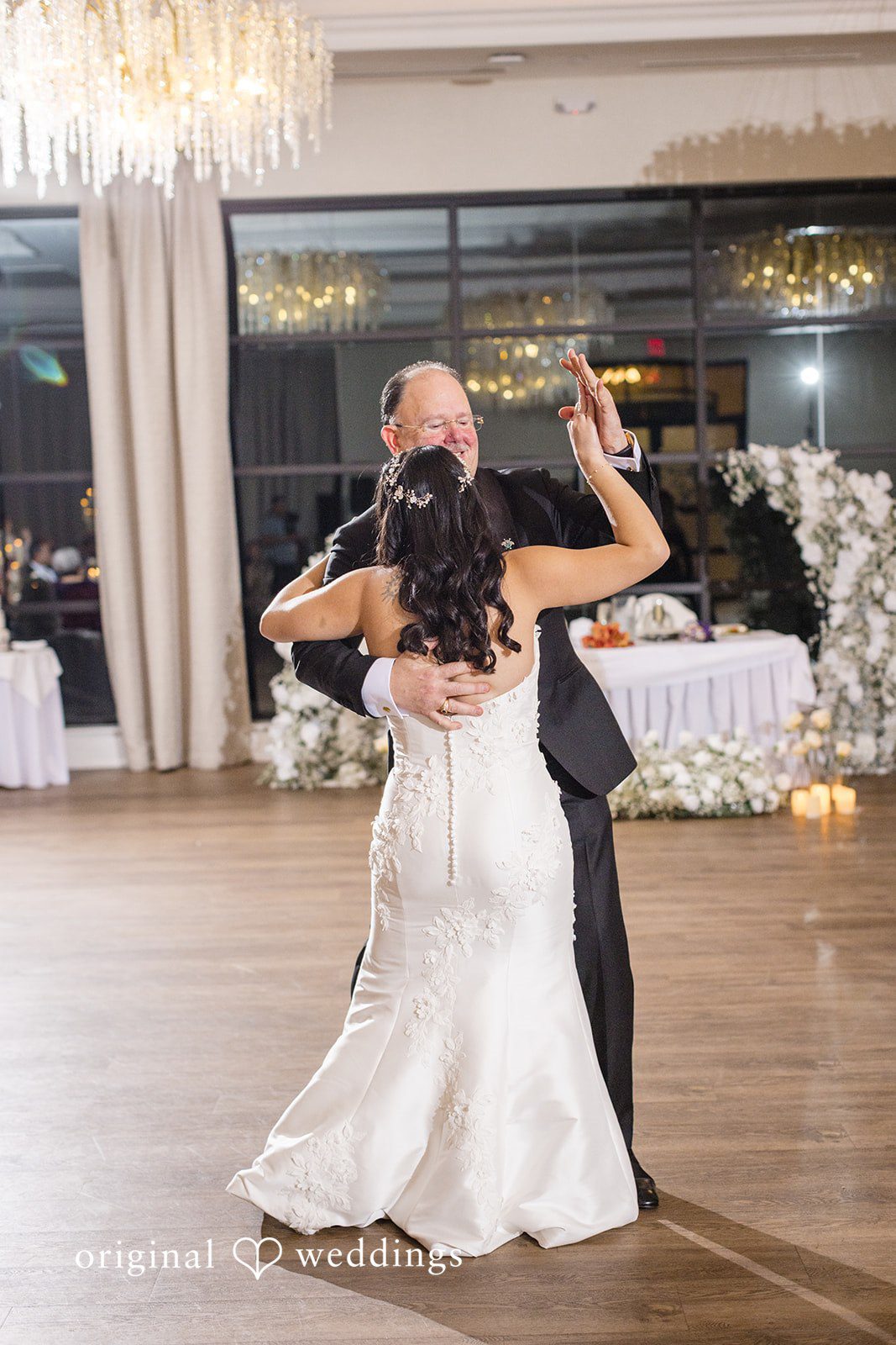 Maria + Eddy A bride share a dance with someone during her wedding reception.