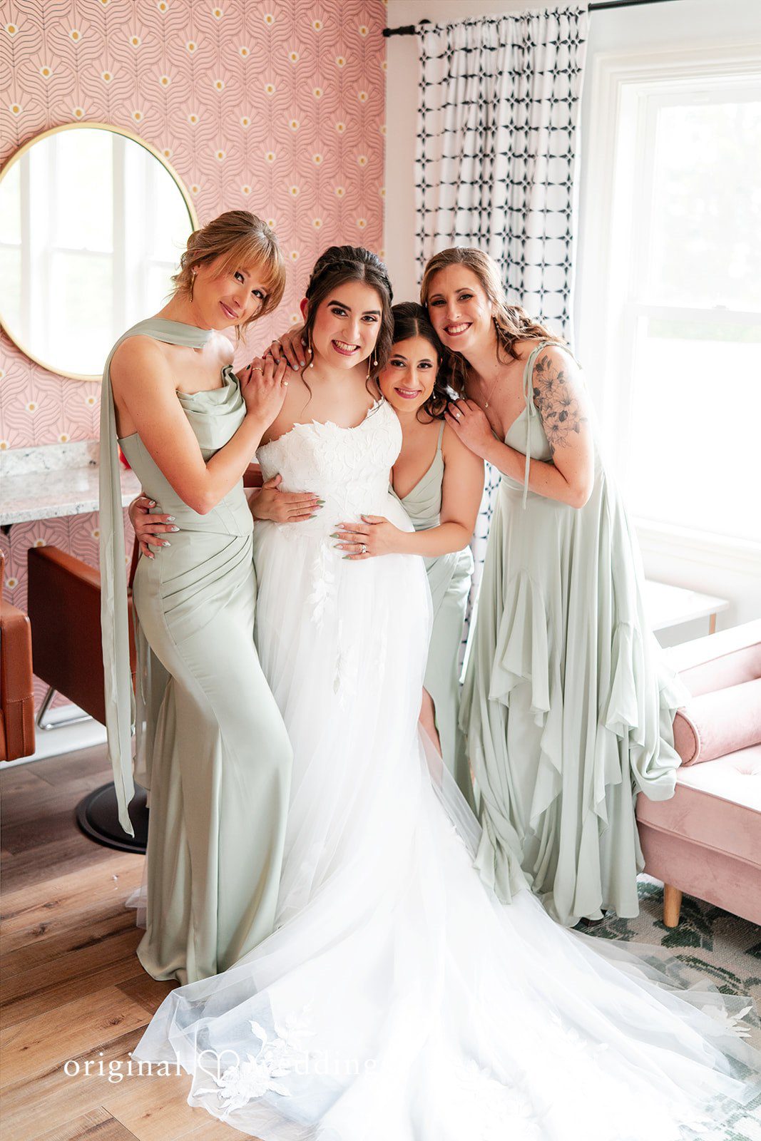 Lovely bride sharing her joy with bridesmaids.
