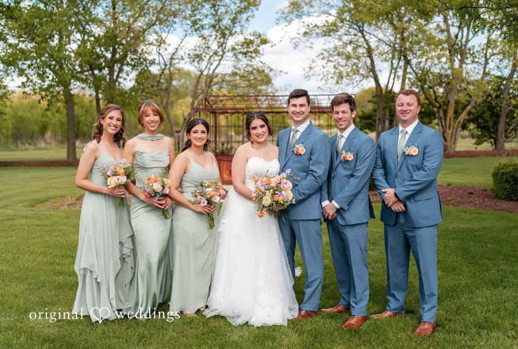 Group picture of couple with bridesmaids and groomsmen captured by Chicago wedding photographers from Original Weddings at Venue 5126