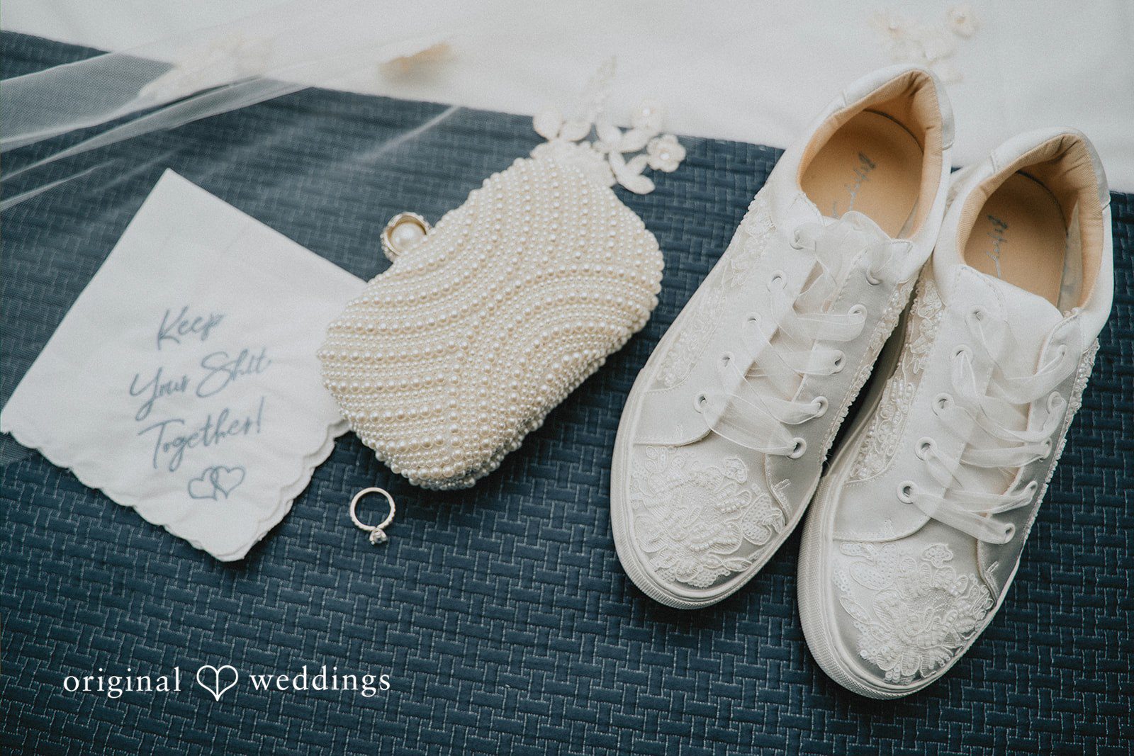 Taylor + David Wedding rings and invitation suite arranged for an elegant wedding detail photograph