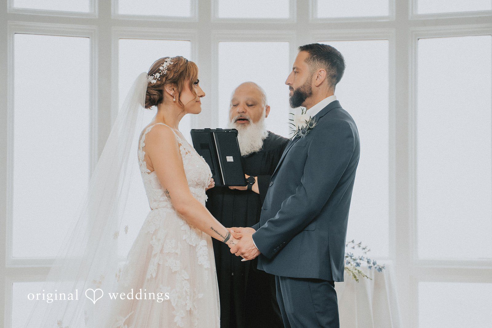 Taylor + David Bride and groom exchanging heartfelt vows during their wedding ceremony