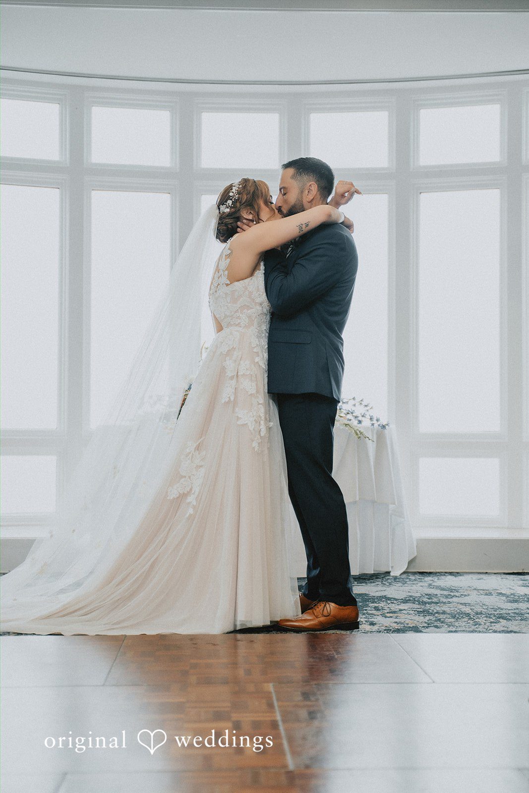 Taylor + David Newlyweds sharing their first embrace after exchanging vows
