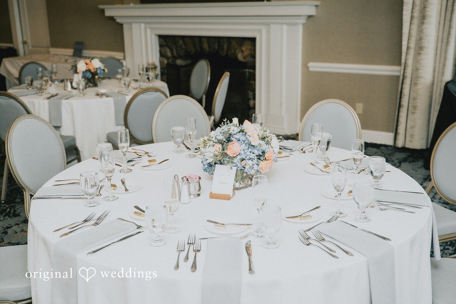 Taylor + David Reception table décor with floral arrangements and candle details
