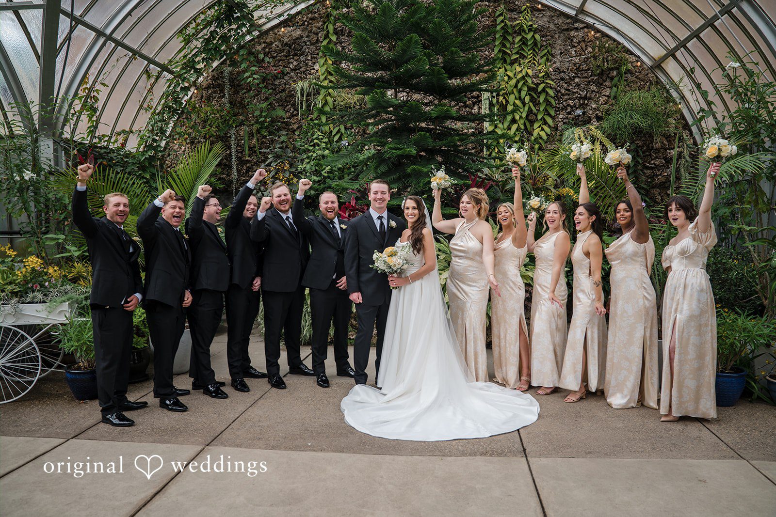 Ann + Justin Our Detroit wedding photographers at Original Weddings captured a stunning portrait of the couple and their bridal party at Waterview Loft