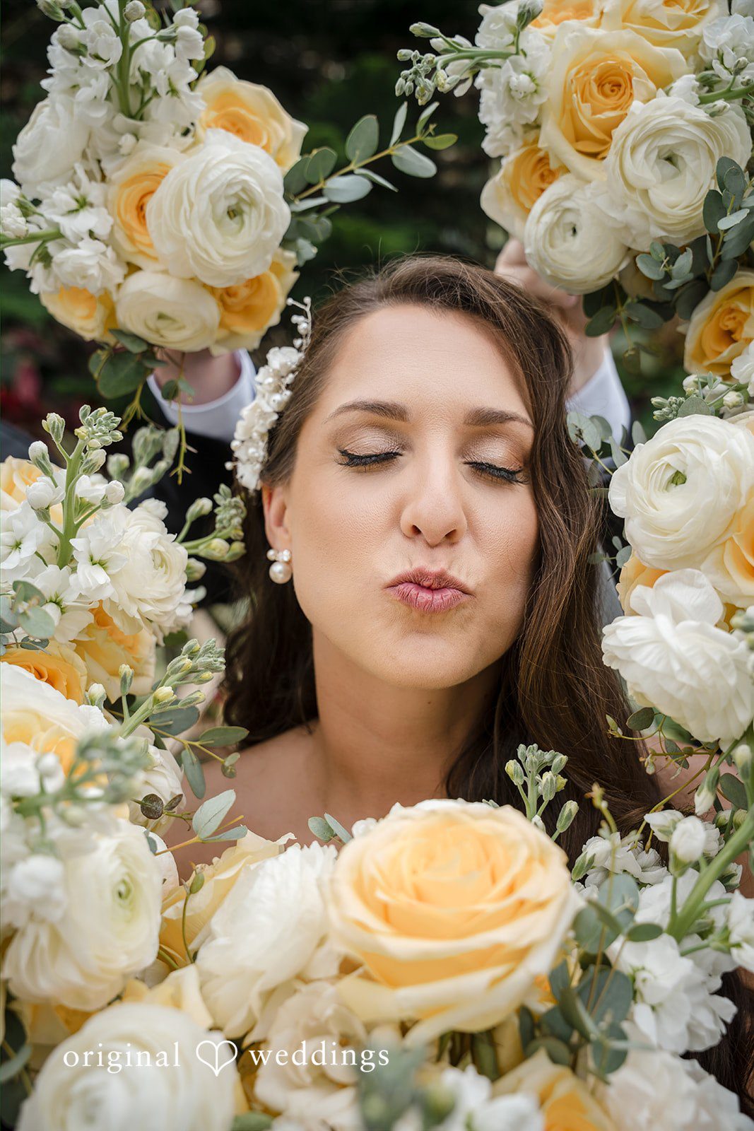 Ann + Justin A beautiful portrait of the bride wrapped in blooms