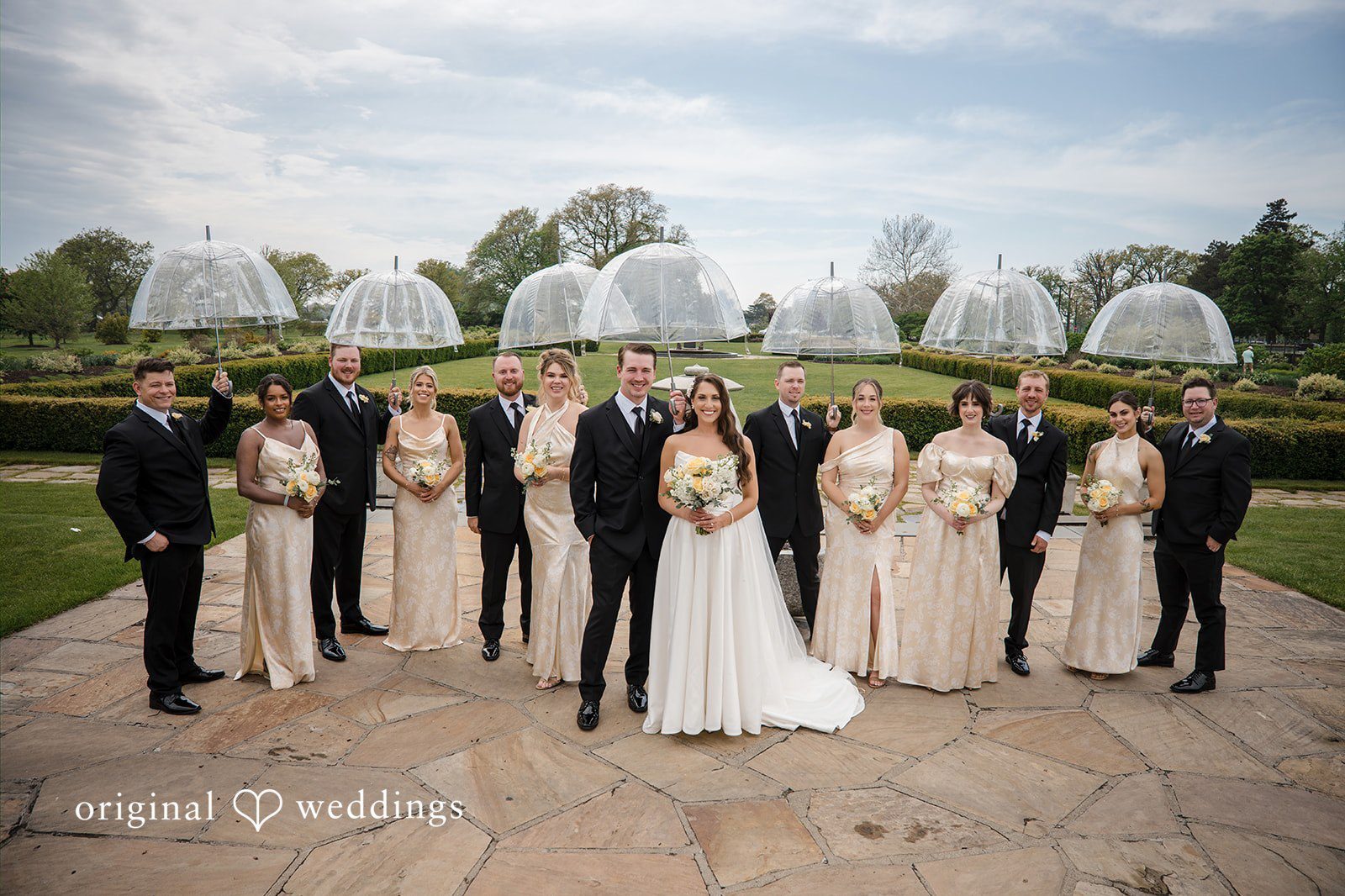 Our Detroit wedding photographers at Original Weddings captured a stylish portrait of the couple and their bridal party at the Waterview Loft