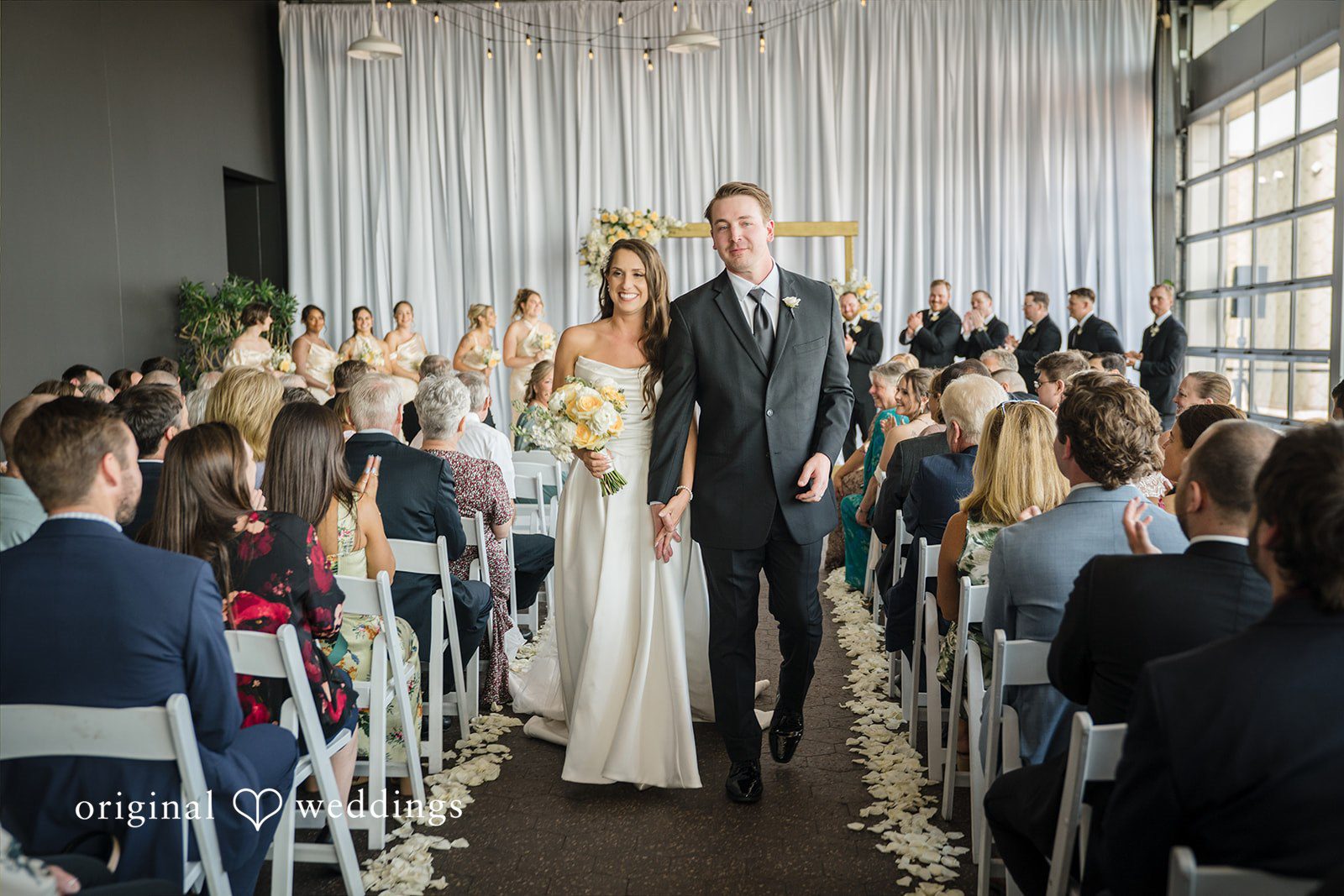 Ann + Justin Our Detroit wedding photographers captured the moment the couple made a joyful exit
