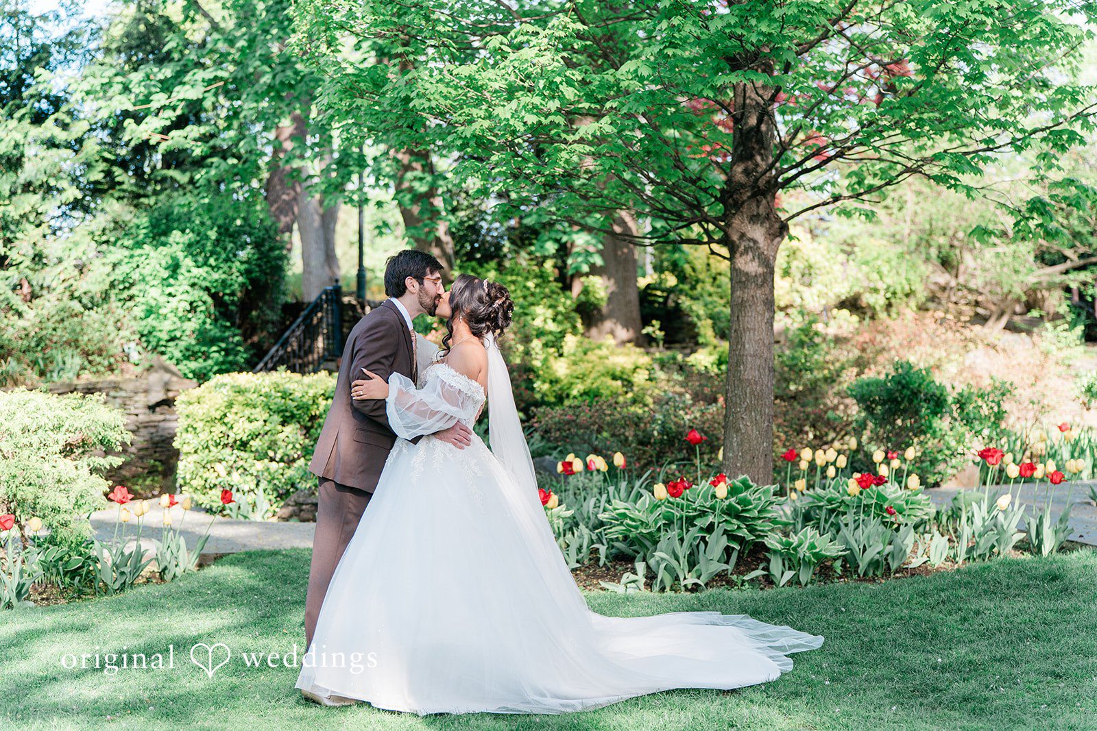 Sabrina + Jonathan Romantic kiss moment of bride and groom during the wedding photoshoot