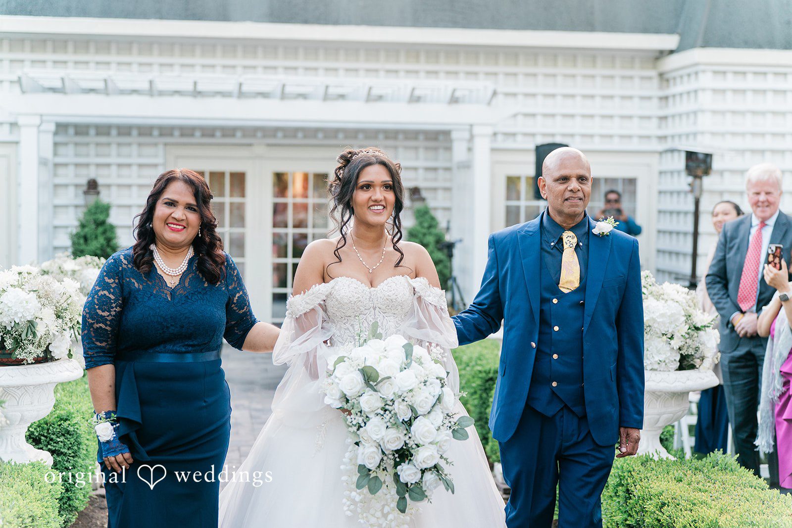 Sabrina + Jonathan Lovely bride walking down the aisle for ceremony at Westbury Manor