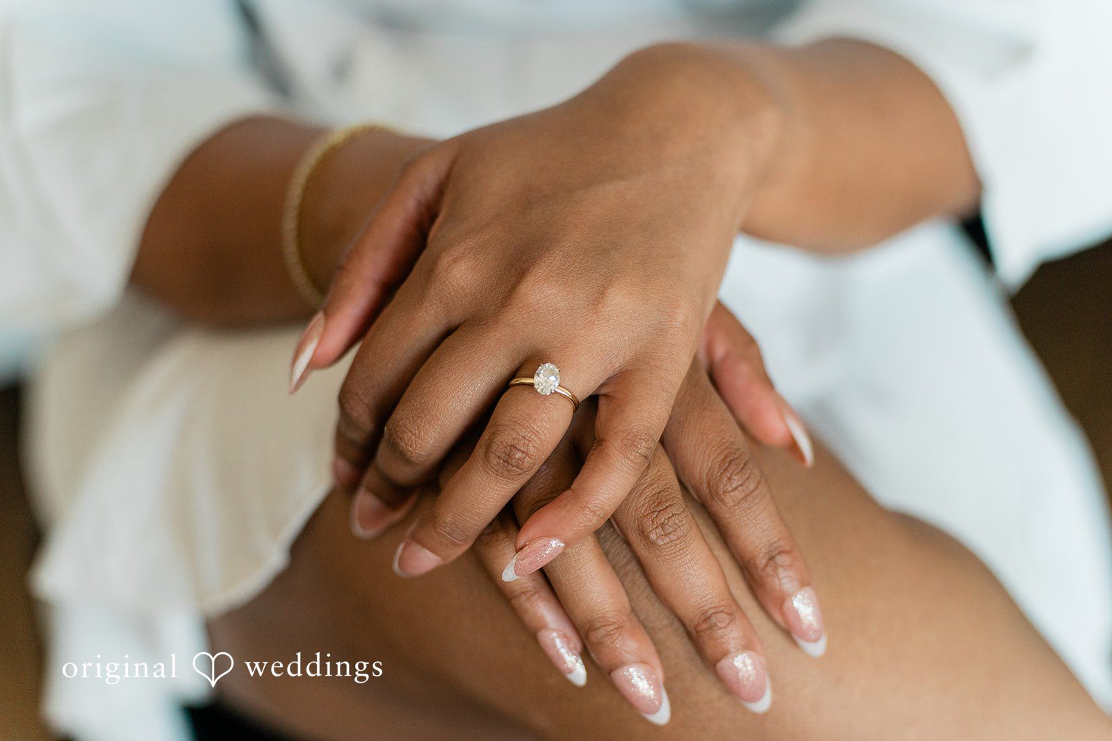 Sabrina + Jonathan Picture of bride's hand with wedding ring