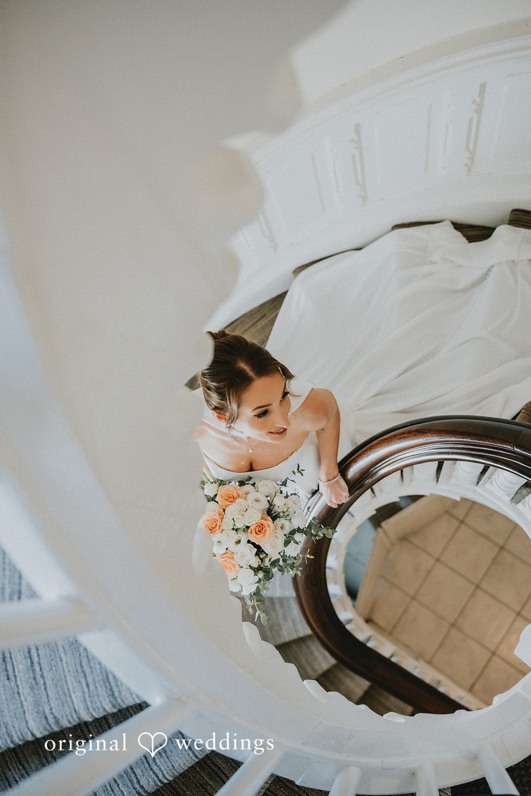 A stylish portrait of the bride by the stairs