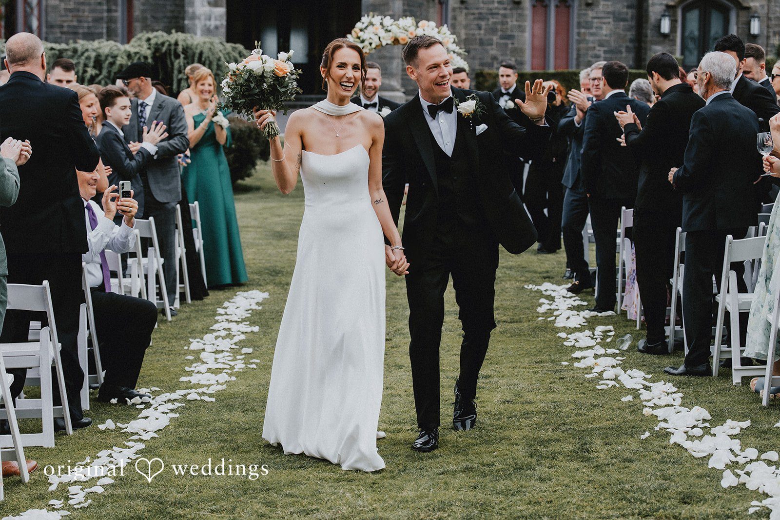 Our New York City wedding photographers at Original Weddings captured the moment the couple made a joyful exit after their wedding ceremony