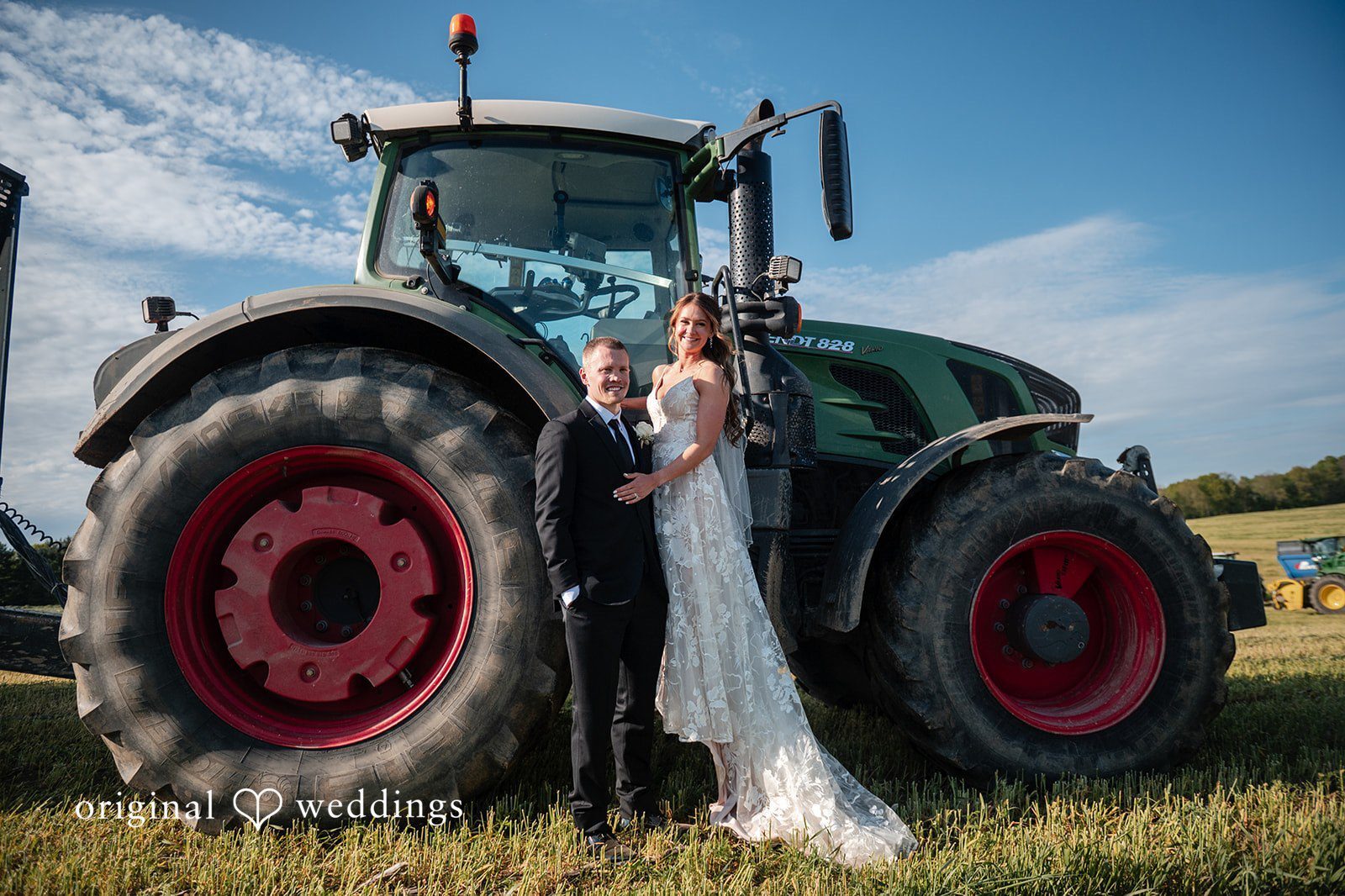 Our Cleveland wedding photographers at Original Weddings captured a stunning portrait of the couple beside the big truck at the White Rose Barn