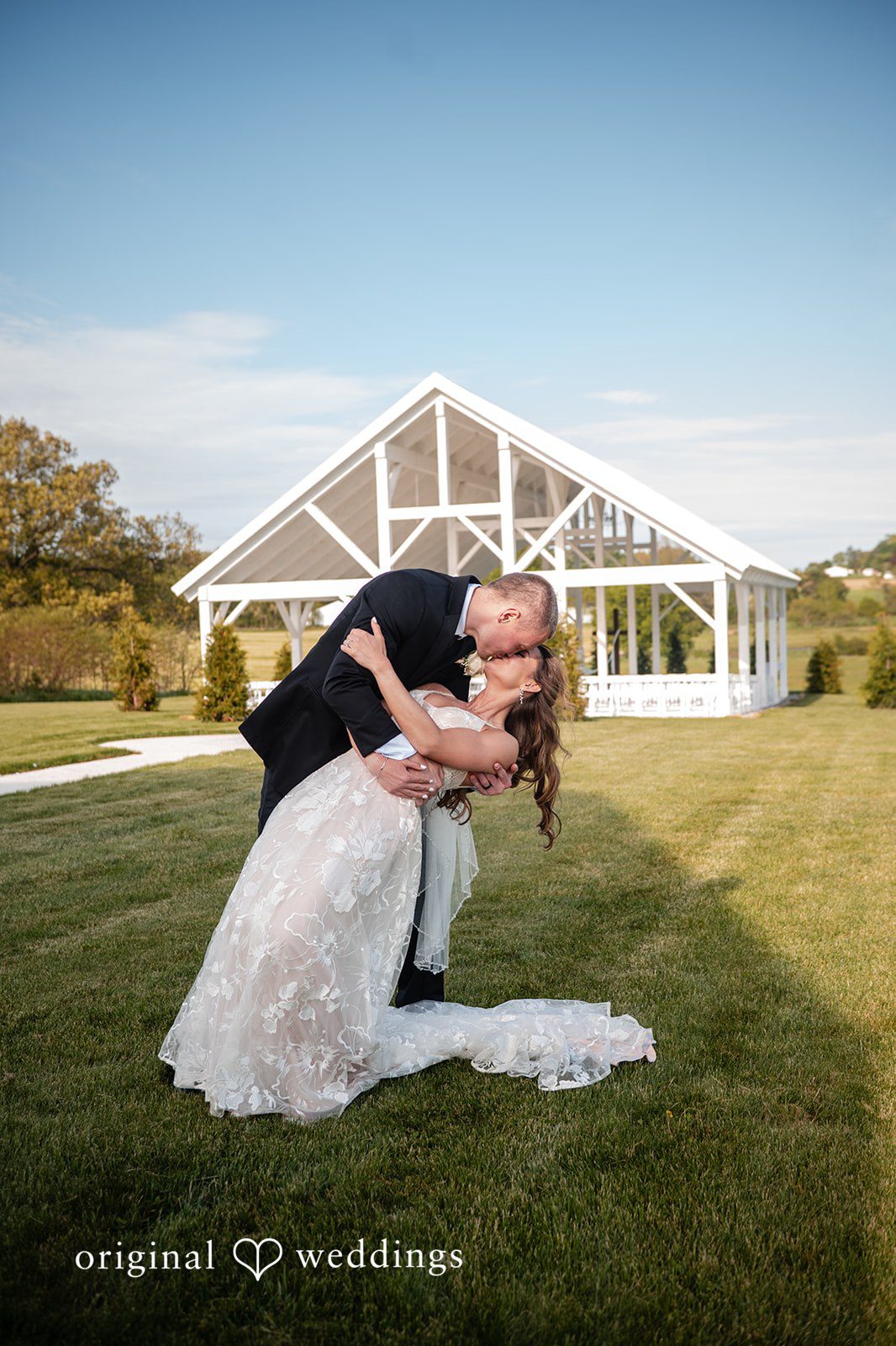 Lauren + Ron The couple shares a romantic kiss in the outdoors
