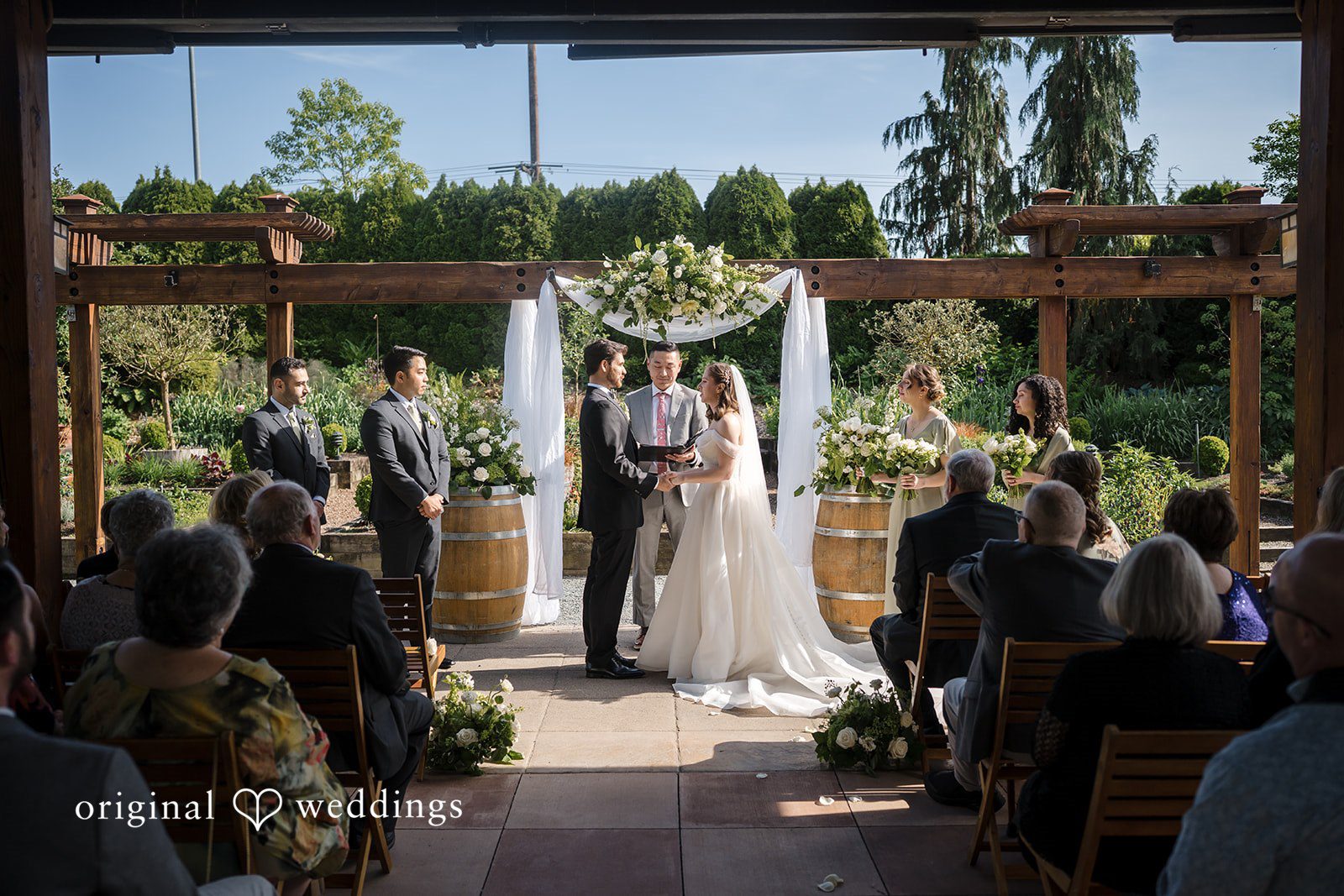 Beautiful picture of couple during wedding ceremony at Willows Lodge