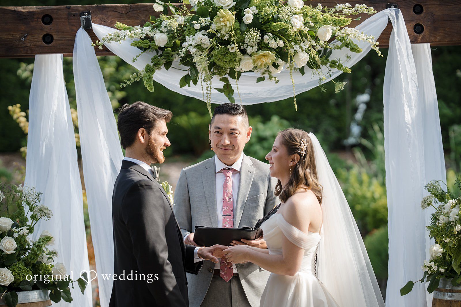 Couple exchanging vows during ceremony at Willows Lodge