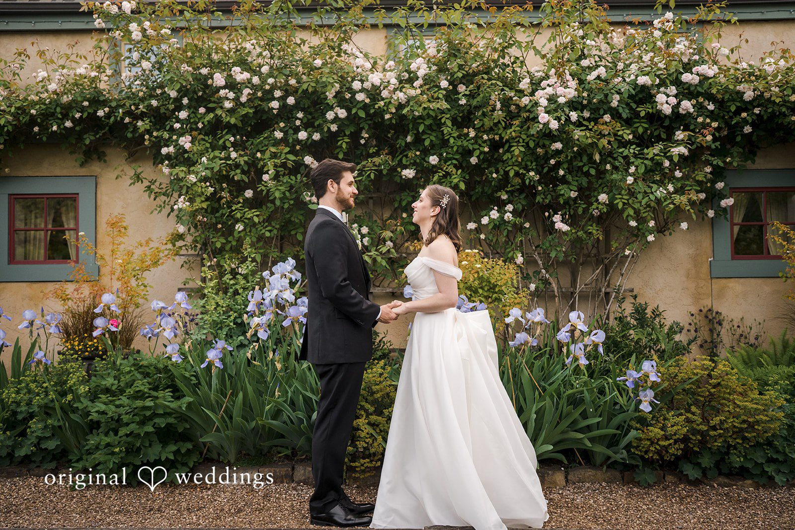 Lovely picture of bride and groom looking at each other while holding hands