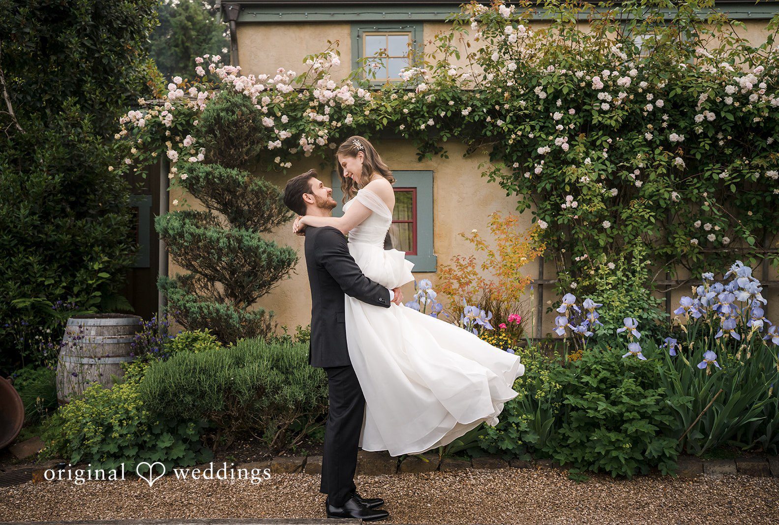 Groom upholding the bride at Willows Lodge captured by Seattle wedding photographers from Original Weddings
