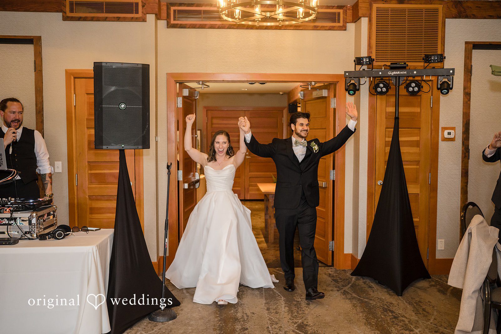 Couple entering the reception hall with excitement