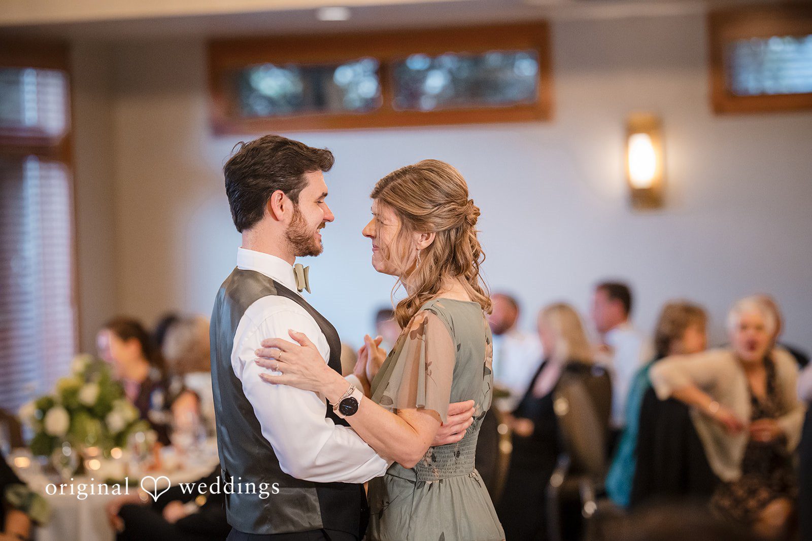 Groom having a dance with a woman