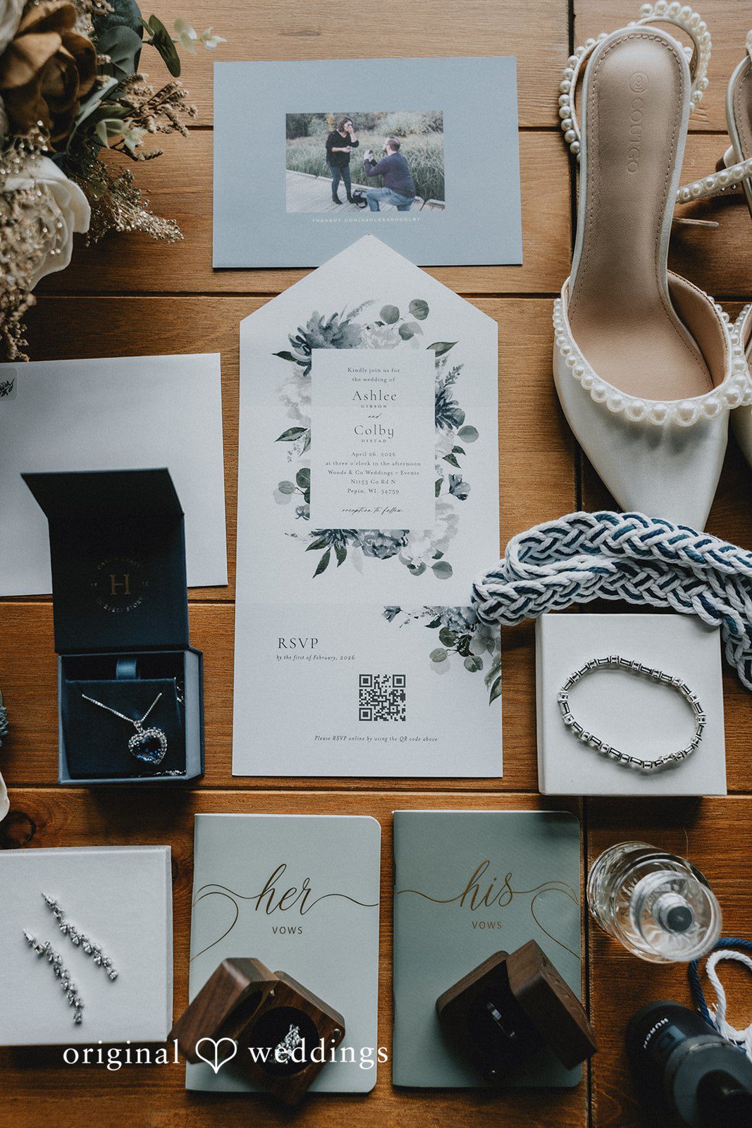 Ashlee + Colby Wedding invitation suite with rings, perfume, and bridal shoes styled for detail photography