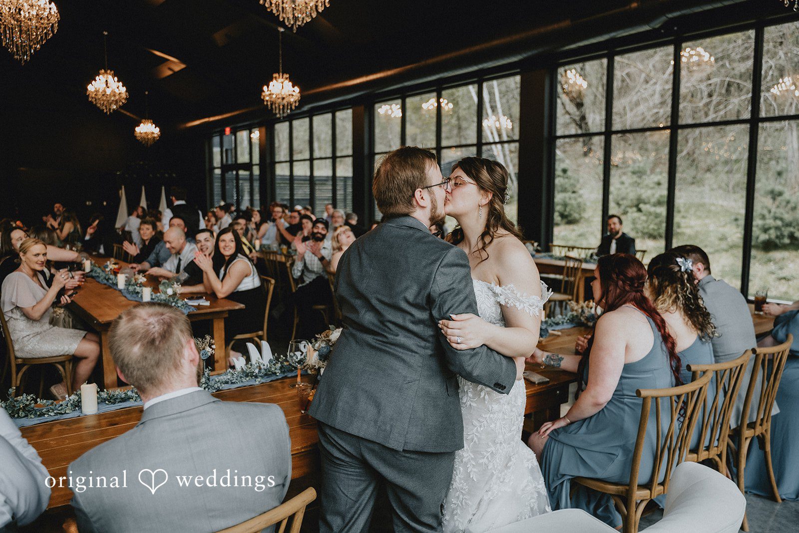 Ashlee + Colby Bride and groom sharing a kiss during the reception festivities