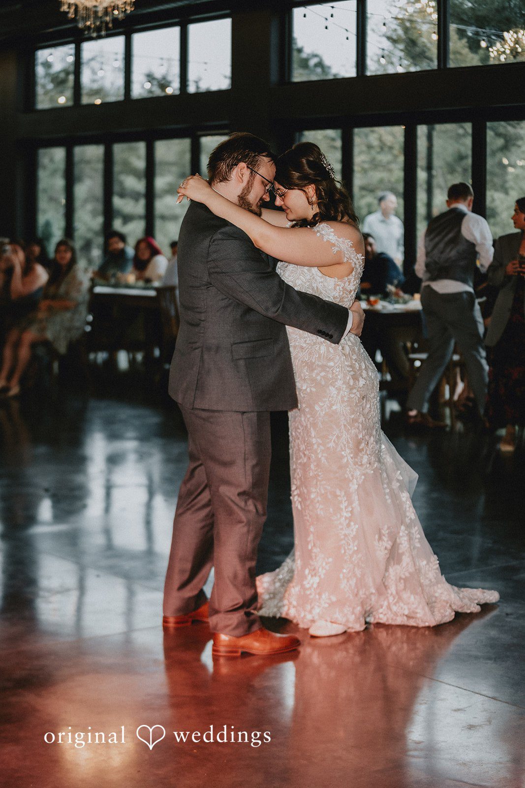 Ashlee + Colby Bride and groom sharing their first dance at the wedding reception