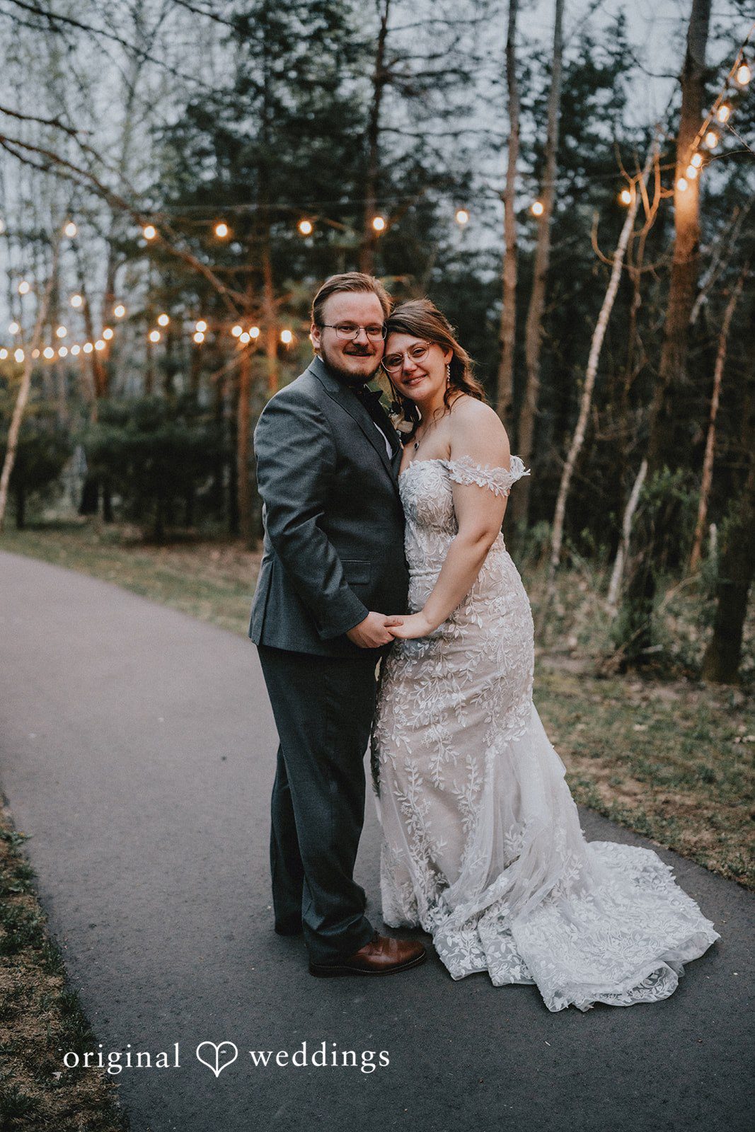 Ashlee + Colby Full-length portrait of the bride and groom at the end of their wedding day