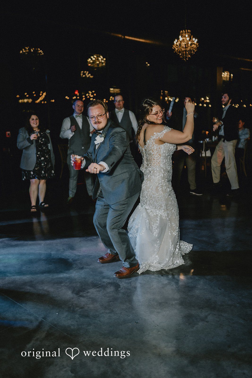 Ashlee + Colby Bride and groom celebrating with guests during a lively reception party
