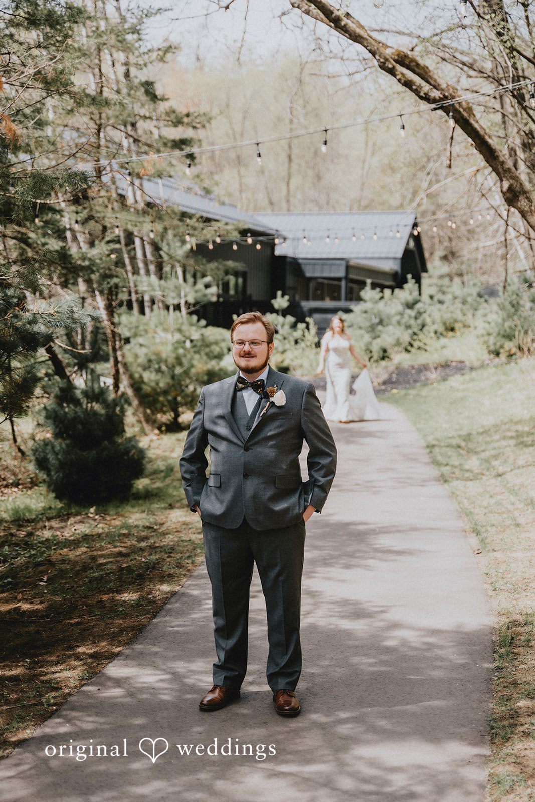 Ashlee + Colby Groom standing with his back turned as the bride approaches for their first look
