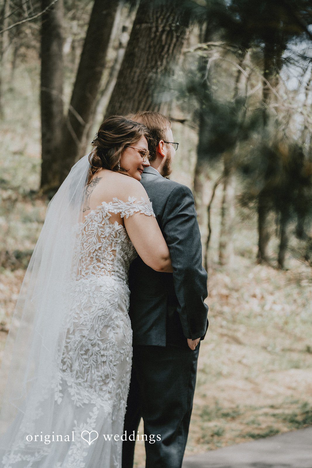 Ashlee + Colby Bride hugging the groom from behind during a romantic wedding portrait