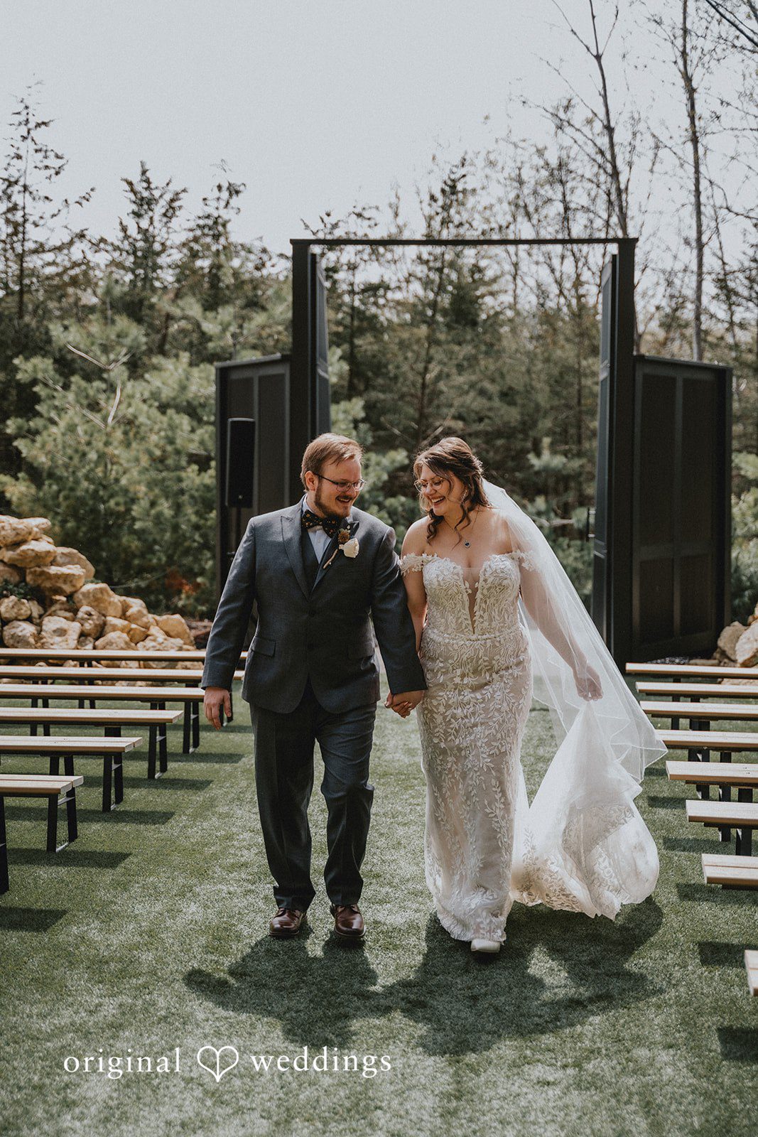 Ashlee + Colby Bride and groom walking together outdoors at Woods and Co