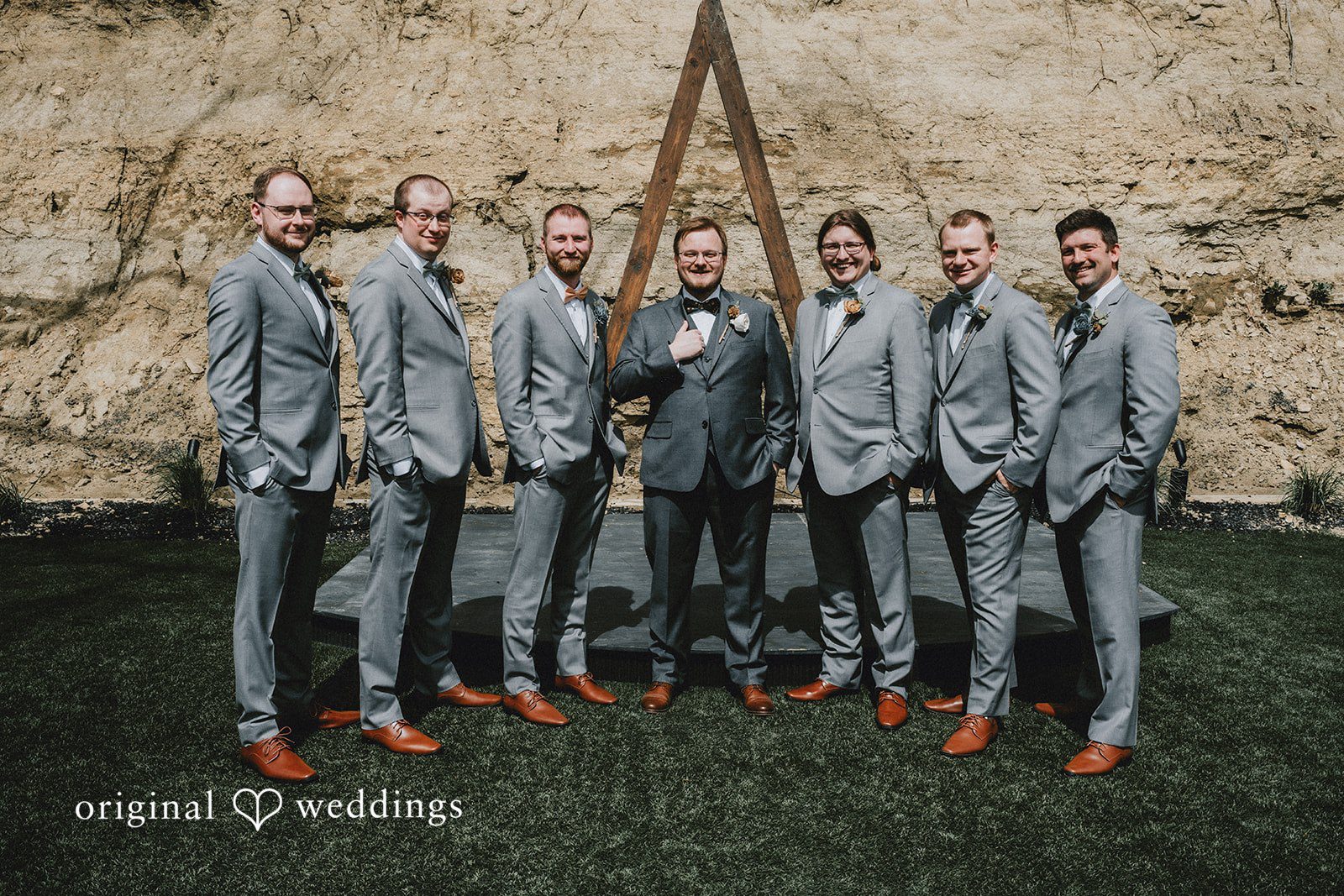 Ashlee + Colby Groom and groomsmen gathered together for a formal wedding portrait