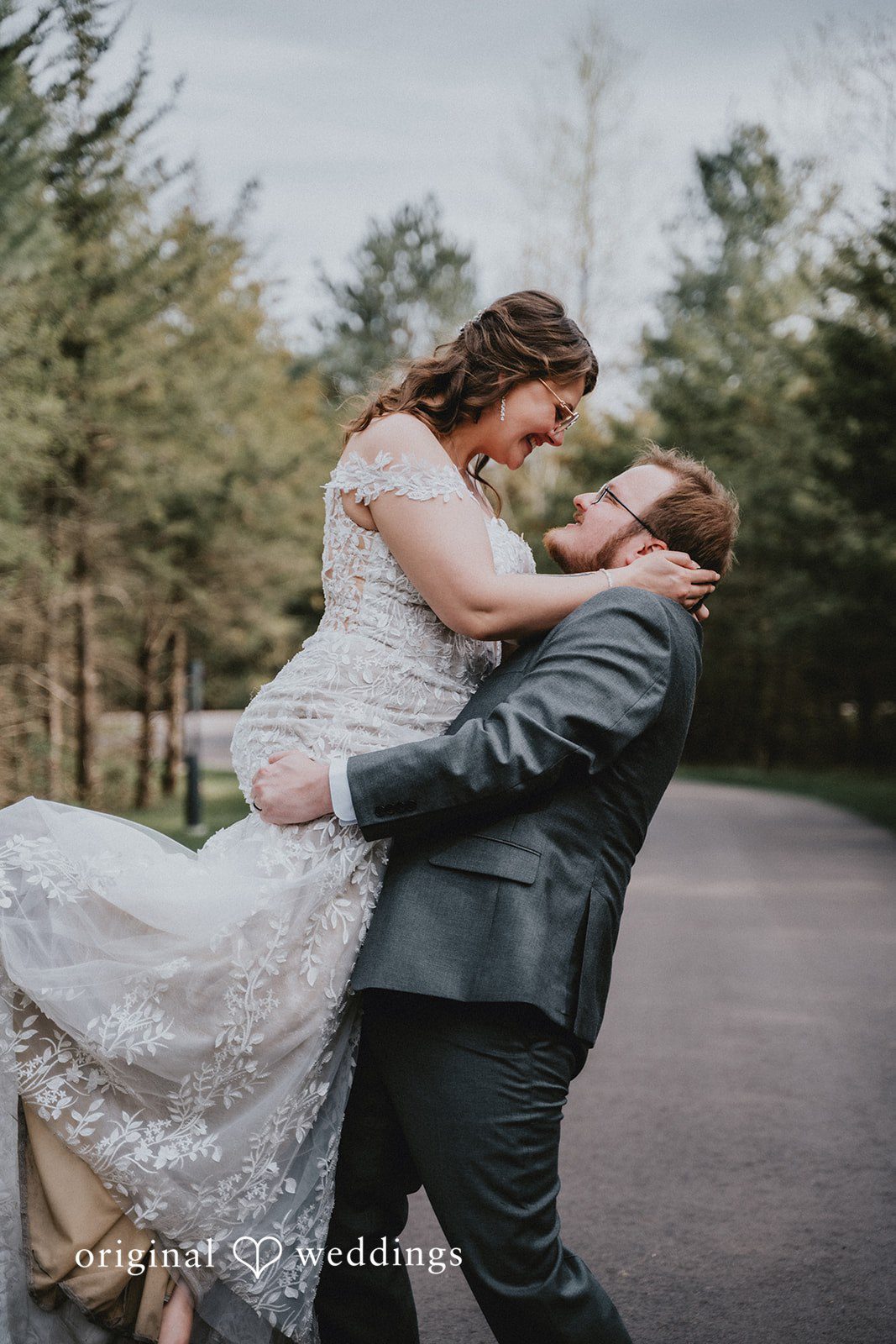 Ashlee + Colby Groom lifting the bride in a joyful and romantic wedding moment