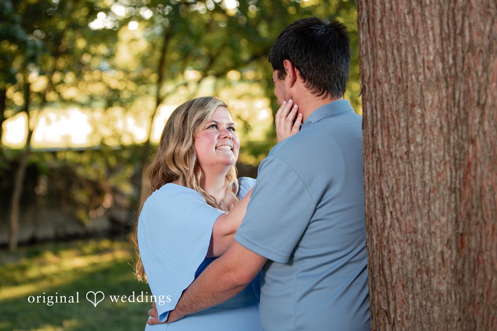 Miranda + Tyler Couple sharing eye contact and smiling at Baker Park