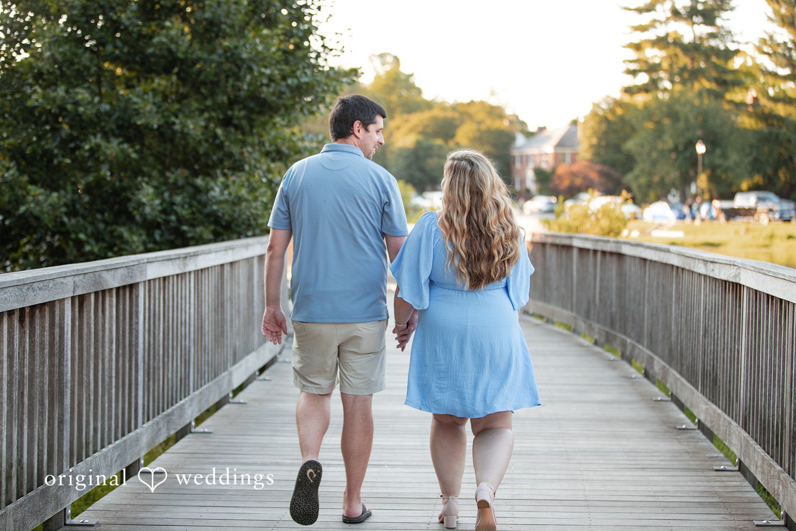 Miranda + Tyler Back view of the couple walking together at Baker Park