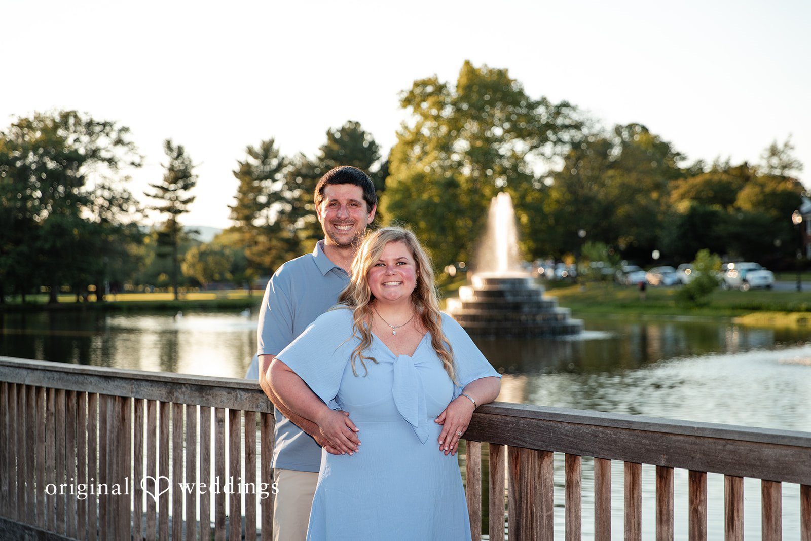 Miranda + Tyler Groom standing behind the bride as they smile at the camera at Baker Park