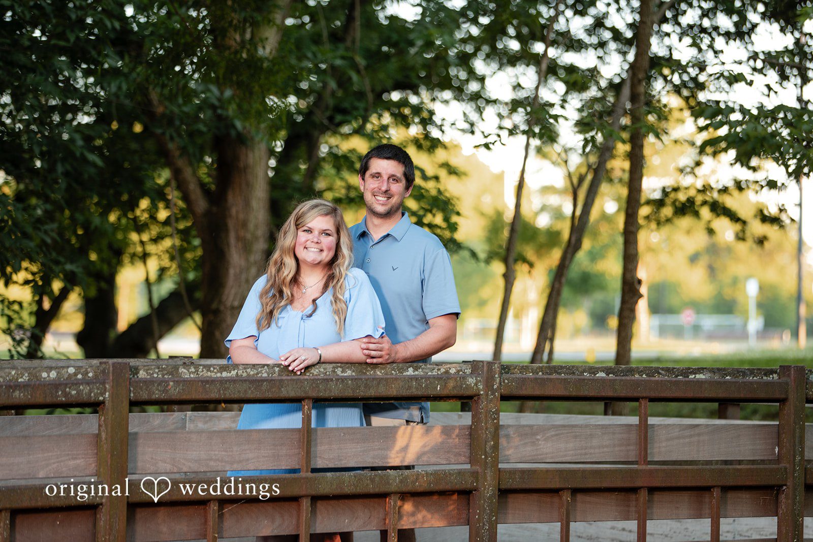 Miranda + Tyler Couple smiling with the groom standing behind the bride at Baker Park