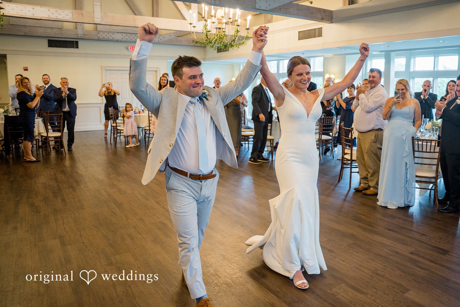 Molly + Joe A bride and groom joyfully dance together at their wedding reception venue.