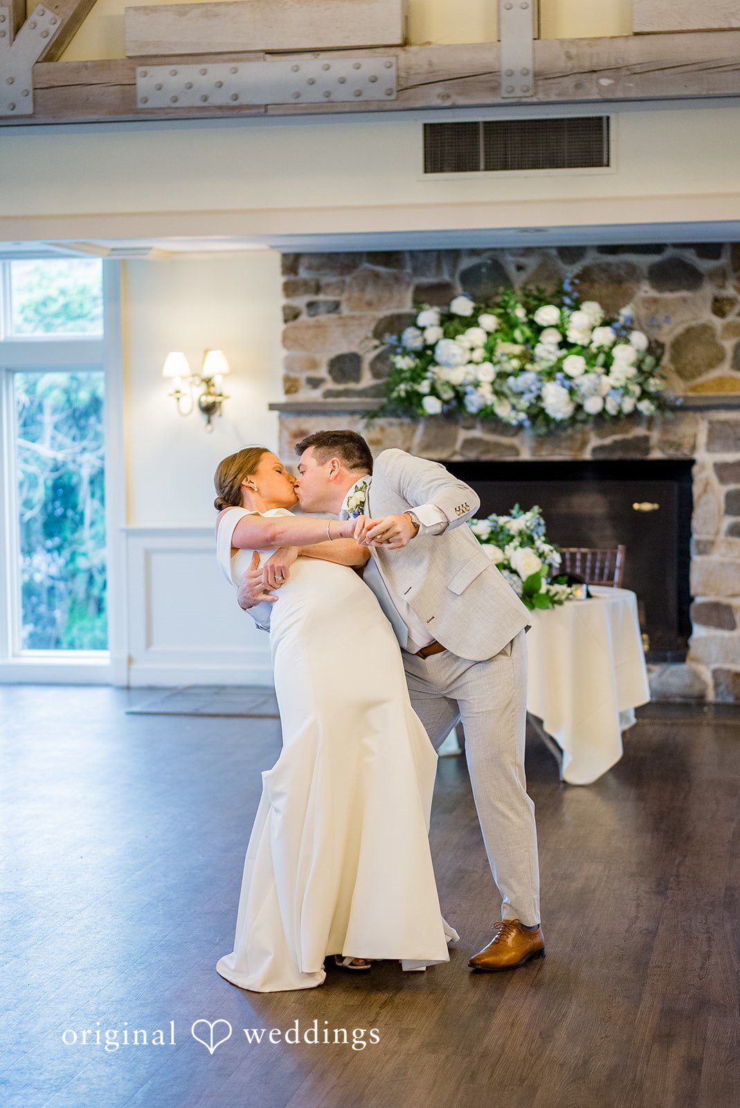 Molly + Joe A bride and groom share a kiss while dancing at their wedding reception.