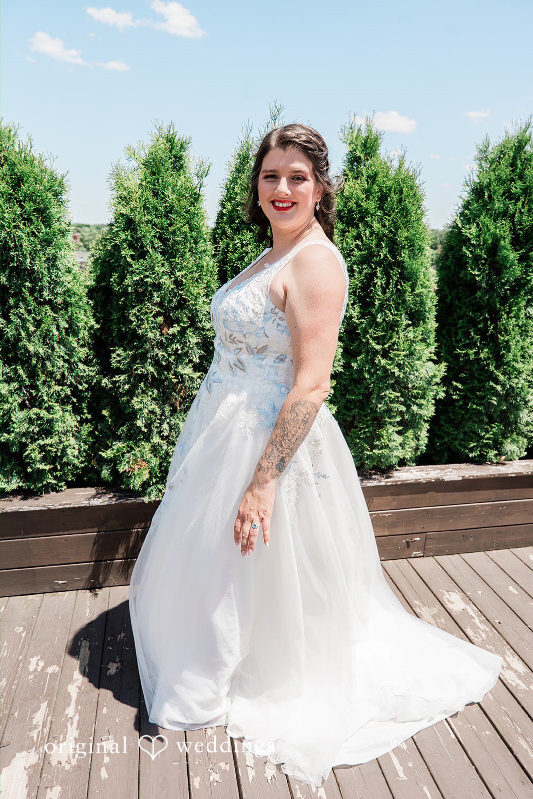 Rachel + Nick Bride smiling in a solo portrait at Batch No. 154