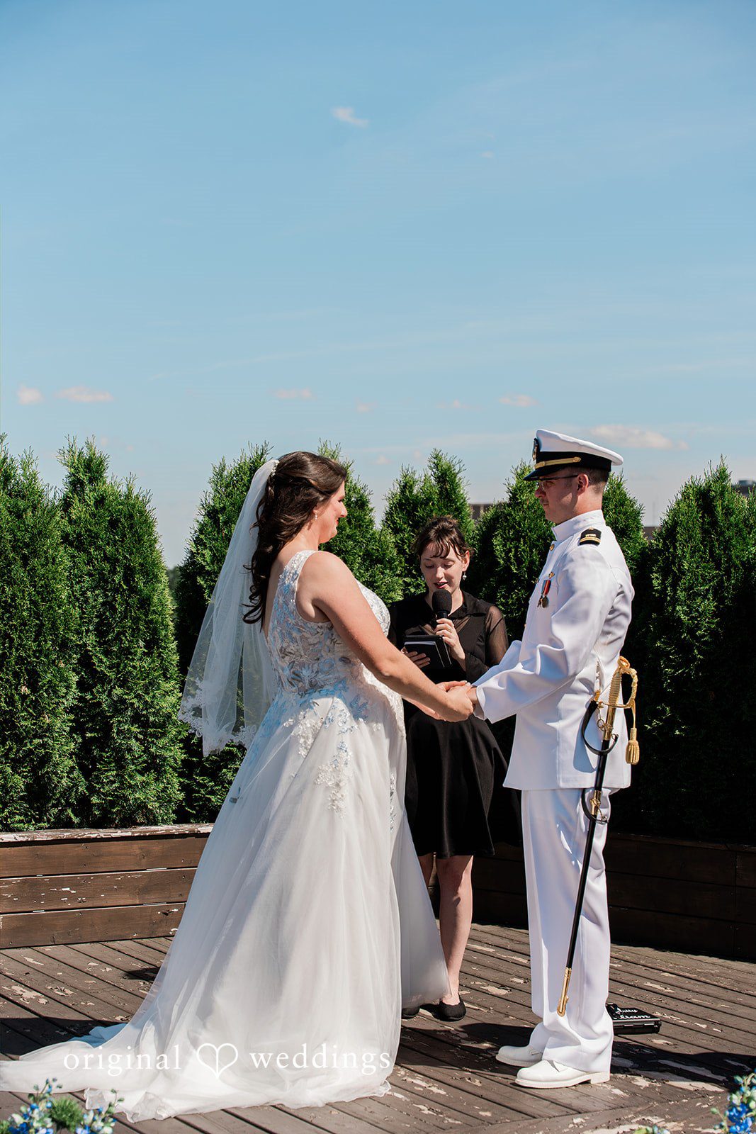 Rachel + Nick Couple holding hands while looking at each other at Batch No. 154