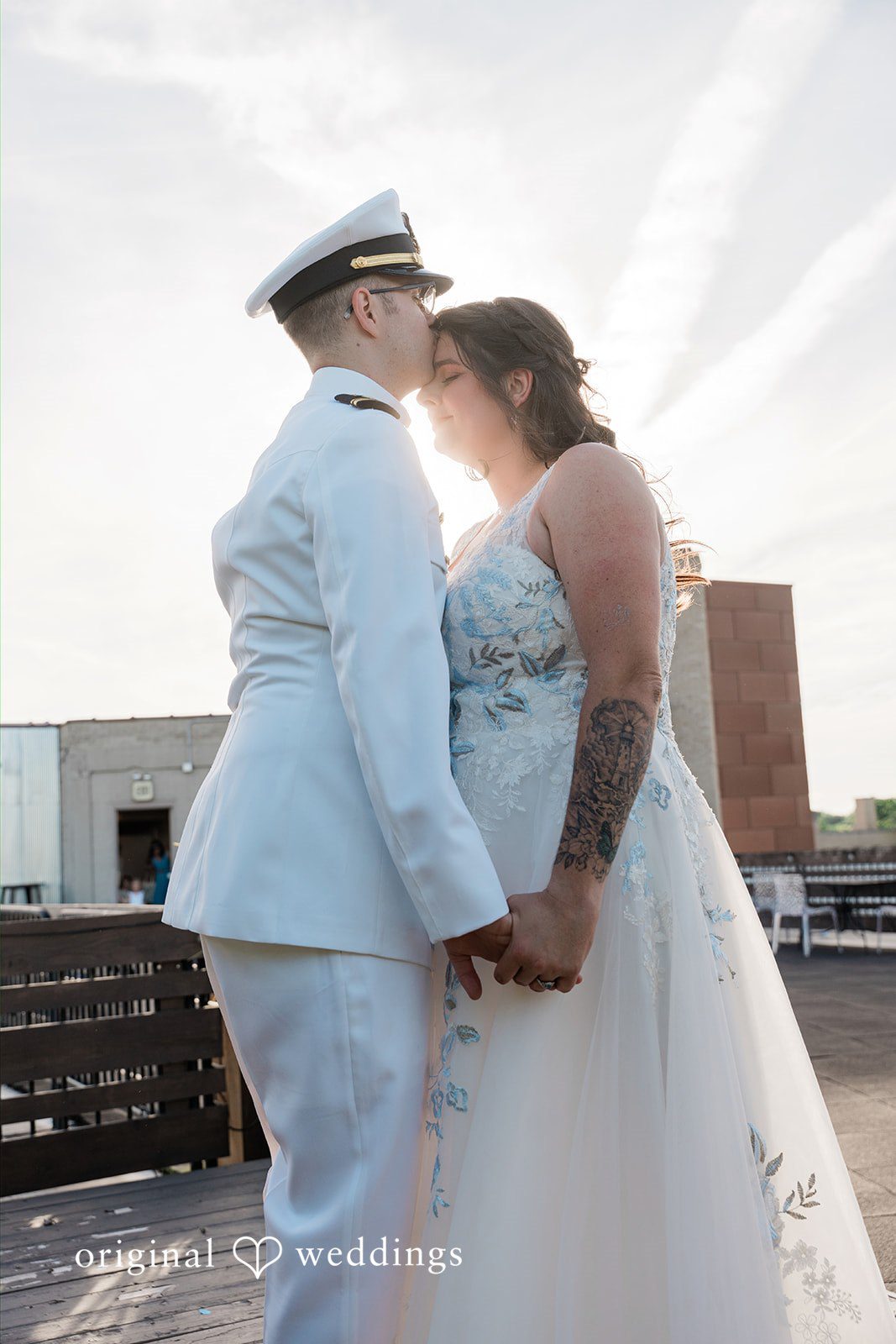 Rachel + Nick Bride smiling as the groom kisses her forehead at Batch No. 154