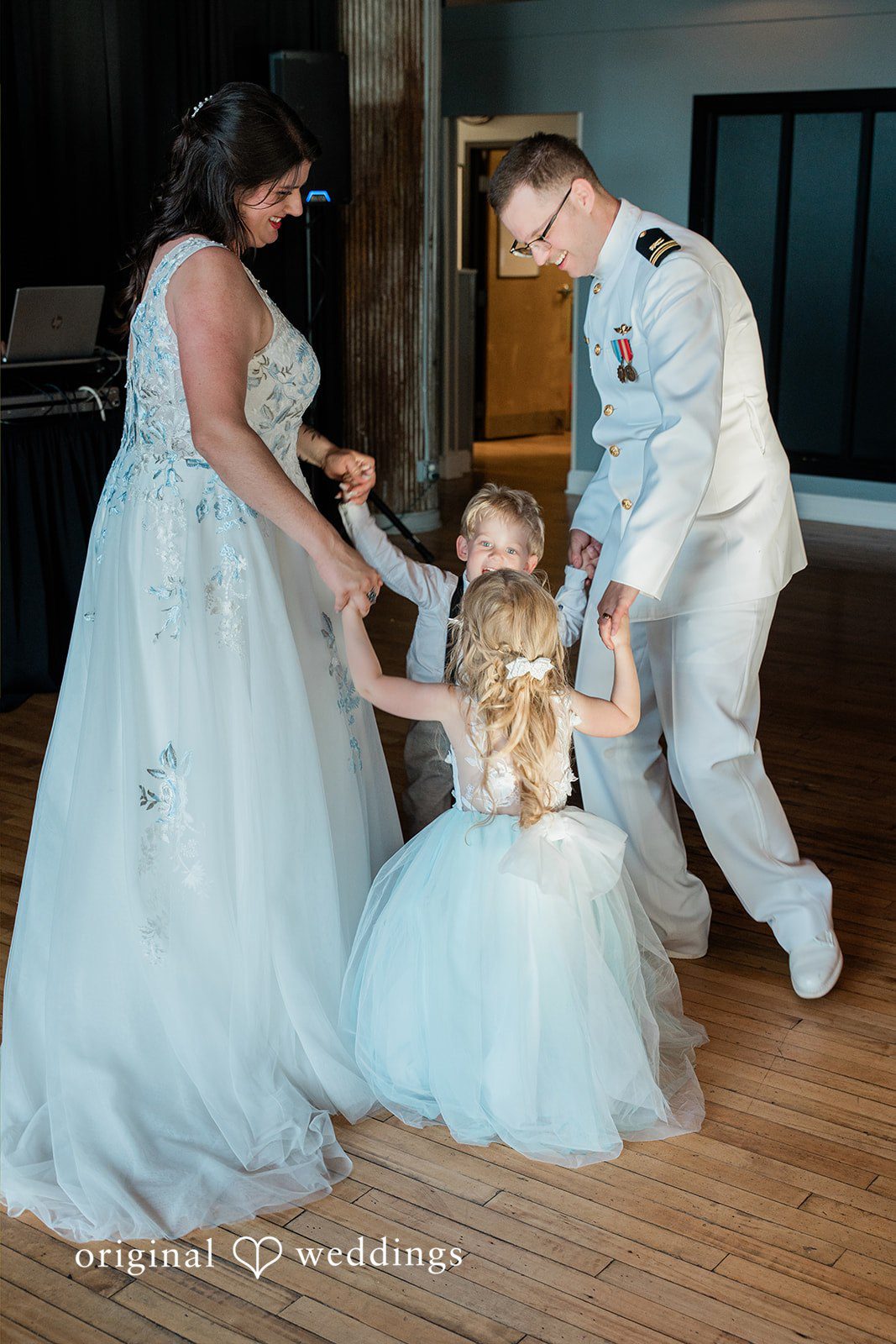 Rachel + Nick Detroit Wedding Photographers capturing couple with children at Batch No. 154 by Original Weddings
